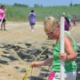 Tammi Hartz measuring sea level